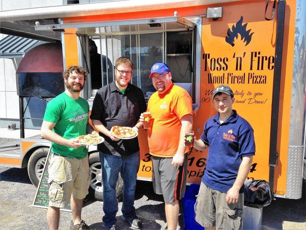 Teaming up craft beer and food trucks: Kevin Williams and Rockney Roberts of Willow Rock Brewing Co. with Charles Cerminaro and Matt Leo from Toss 'n Fire Wood-fired Pizza. Toss 'n Fire sets up frequently on Fridays or Saturdays in the parking lot at Willow Rock, 115 Game Road in Syracuse. (Don Cazentre)